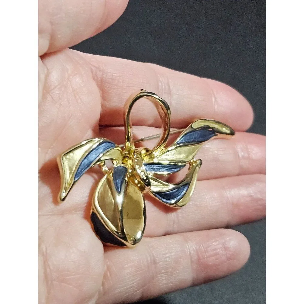 Vintage gold tone blue enamel bow brooch